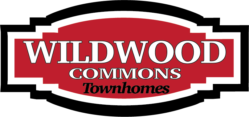 A logo for Wildwood Commons Townhomes.